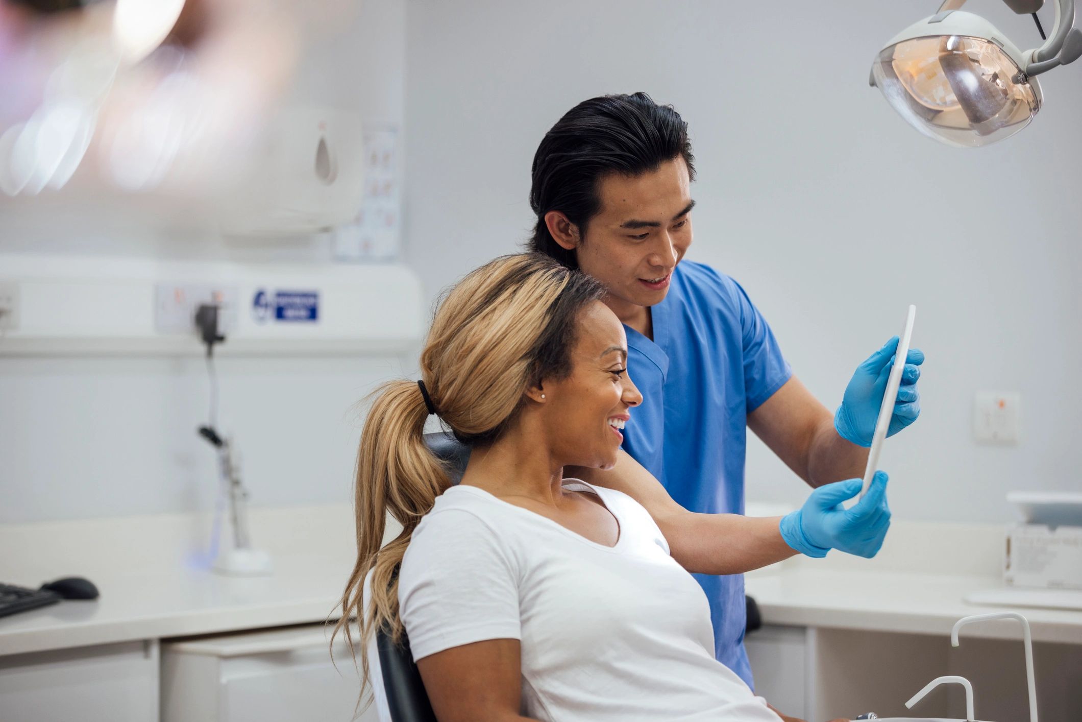 Dentist reviewing treatment progress with patient